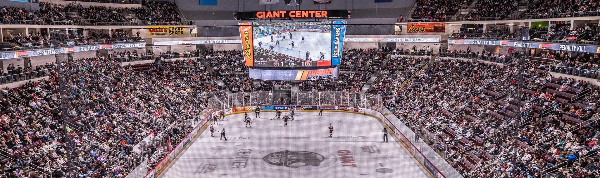 Interior of GIANT Center from above showcasing the ice hockey rink.
